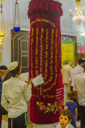 Safed, Israel - September 28, 2021: Jewish people pray, part of Simchat Torah tradition, in the old Abuhav synagogue, the Jewish quarter, Safed (Tzfat), Israelのeditorial素材