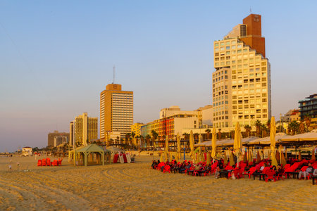 Tel-Aviv, Israel - November 22, 2021: Sunset view of the beach scene, with hotels buildings and visitors. Tel-Aviv, Israelのeditorial素材