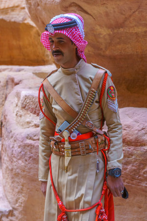 Petra, Jordan - October 23, 2021: Portrait of a local man in historic Jordanian army uniform, in the ancient Nabatean city of Petra, Southern Jordanのeditorial素材