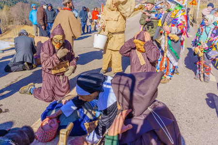 Valfloriana, Italy - February 26, 2022: Carnival participants perform a short play, in the Valfloriana carnival, Trentino, Northern Italyのeditorial素材