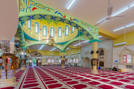 Tayibe, Israel - April 09, 2022: View of the interior Salah al-Din Mosque, with Ramadan prayers, in the ancient center of Tayibe, a Muslim Arab town in central Israelのeditorial素材