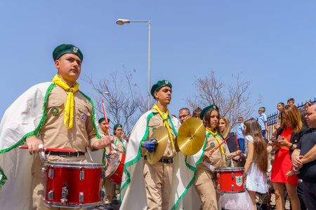 Haifa, Israel - April 10, 2022: Scout drummers and others take part in the Easter Palm Sunday parade...