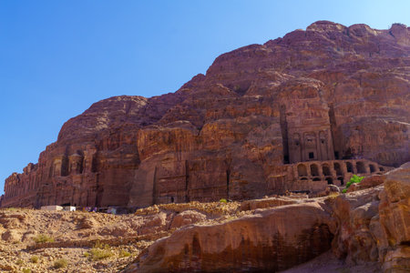 View of graves carved in the rocks, in the facades street, the ancient Nabatean city of Petra, Southern Jordanのeditorial素材