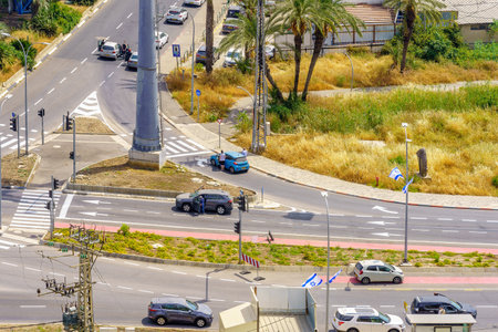 Haifa, Israel - May 04, 2022: Road scene with people standing still near their cars for the sound of...