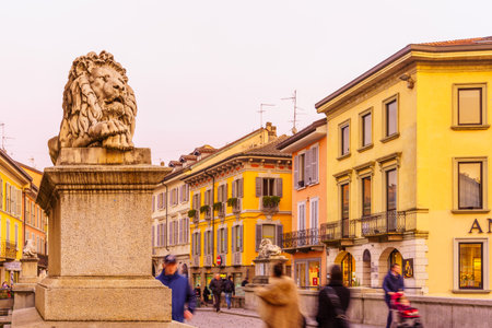 Monza, Italy - February 24, 2022: Sunset view of the Ponte dei Leoni (Lion bridge), with locals and visitors, in Monza, Lombardy, Northern Italyのeditorial素材