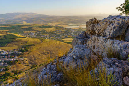 View of rocks and countryside in the background, in mount Arbel, Northern Israelの写真素材