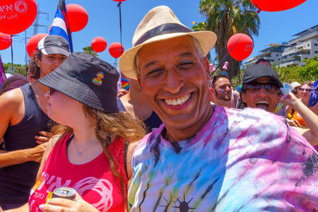 Tel-Aviv, Israel - June 10, 2022: Various people march and take part in the annual Pride Parade of...