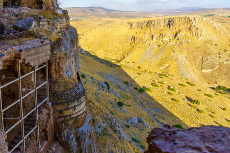 View of remains of an Ottoman Fortress on a cliff, and Mount Nitai, in Mount Arbel National Park,...