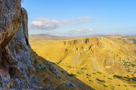 View of rocks, cliffs, footpath, and Mount Nitai, in Mount Arbel National Park, Northern Israel