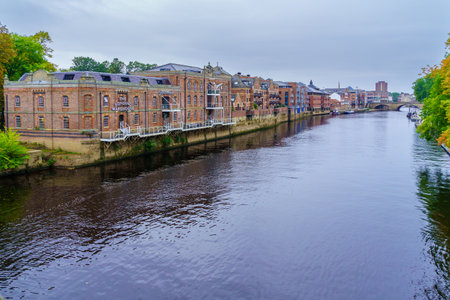 York, UK - September 22, 2022: View of the River Ouse, with old brick buildings, in York, North Yorkshire, England, UKのeditorial素材