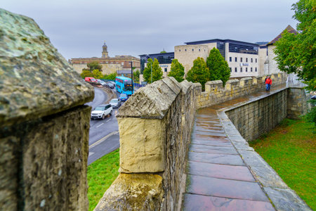 York, UK - September 22, 2022: View of the city wall walk promenade, with visitors and local transportation, in York, North Yorkshire, England, UKのeditorial素材