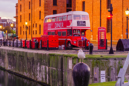 Liverpool, UK - October 08, 2022: Sunrise view of the Royal Albert Dock, with various buildings, in Liverpool, Merseyside, England, UKのeditorial素材