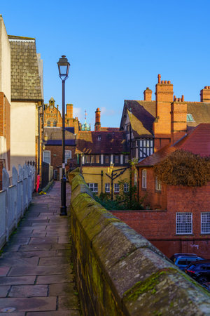 Chester, UK - October 10, 2022: View of the old city walls promenade, and various old buildings, in Chester, Cheshire, England, UKのeditorial素材