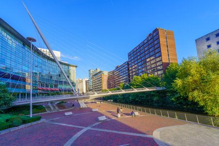 Manchester UK - October 08, 2022: Scene of the River Irwell and the Trinity Bridge, with locals, and visitors, in Manchester, England, UKのeditorial素材