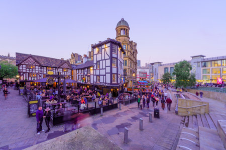 Manchester UK - October 08, 2022: Sunset scene of the Exchange Square, with local businesses, locals, and visitors, in Manchester, England, UKのeditorial素材