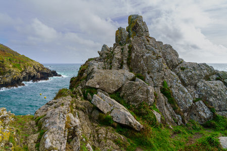View of cliffs along the coastline of the village Polperro, in Cornwall, England, UK