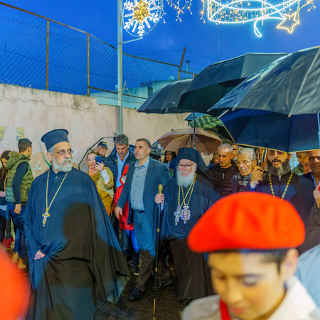 Nazareth, Israel - January 06, 2023: Orthodox Christmas Eve parade, with the patriarch, participants, and crowd, in Nazareth, Israelのeditorial素材