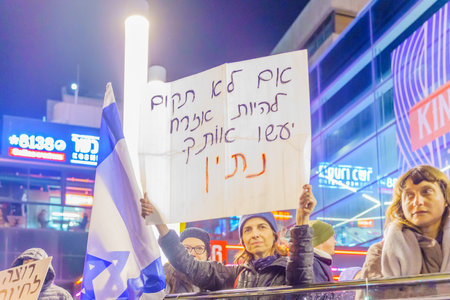 Haifa, Israel - January 14, 2023: People protest with signs against the legislative plans of the new government, in Haifa, Israelのeditorial素材