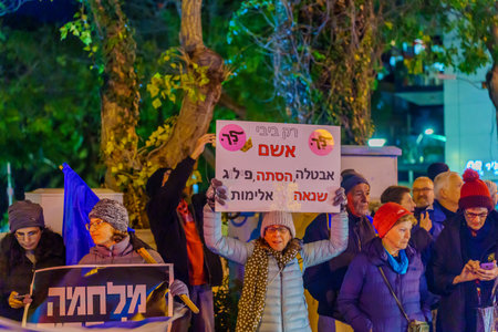 Haifa, Israel - January 14, 2023: People protest with signs against the legislative plans of the new government, in Haifa, Israelのeditorial素材