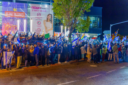 Haifa, Israel - January 14, 2023: Crowd of people protest with various signs against the legislative plans of the new government, in Haifa, Israelのeditorial素材