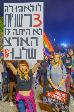 Haifa, Israel - January 28, 2023: Crowd of protesters with various signs and flags attend a demonstration in against the plans of the new government, claiming its anti-democratic, in Haifa, Israelのeditorial素材
