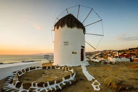 Mykonos, Greece - October 02, 2011: Sunset view of an old windmill, in Mykonos, Mykonos Island, Greeceのeditorial素材