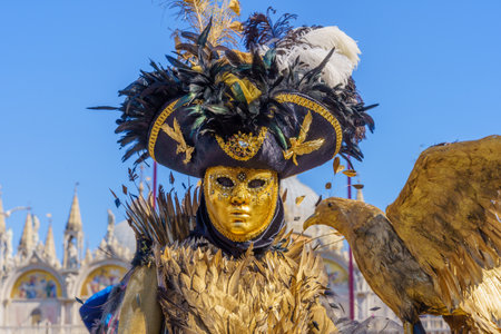 Venice, Italy - March 01, 2022: Woman dressed in traditional costume, in St. Marks Square, part of the Venice Mask Carnival, Veneto, Italyのeditorial素材