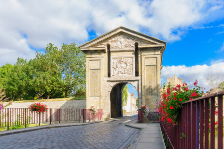 View of the Gate of Cassel, incorporating the radiating sun of Louis XIV, in Bergues, Northern Franceのeditorial素材