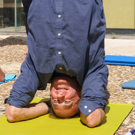 Haifa, Israel - March 16, 2023: Yoga headstand protesters, part of a protest day against the plans of the new government, claiming its anti-democratic, in Haifa, Israelのeditorial素材