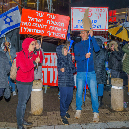 Haifa, Israel - March 18, 2023: Protesters with various signs and flags attend a demonstration against the plans of the new government, claiming its anti-democratic, in Haifa, Israelのeditorial素材