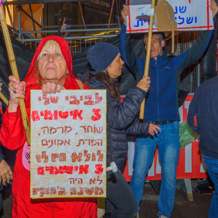 Haifa, Israel - March 18, 2023: Protesters with various signs and flags attend a demonstration against the plans of the new government, claiming its anti-democratic, in Haifa, Israelのeditorial素材