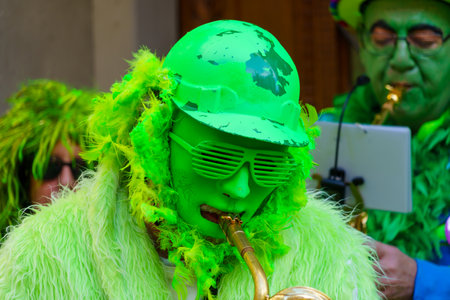 Lucerne, Switzerland - February 20, 2023: Band of musicians in costumes play to the crowd, part of the Fasnacht Carnival, in Lucerne (Luzern), Switzerlandのeditorial素材