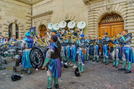 Lucerne, Switzerland - February 20, 2023: Band of musicians in costumes play to the crowd, part of the Fasnacht Carnival, in Lucerne (Luzern), Switzerlandのeditorial素材