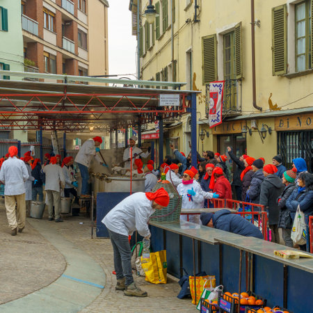 Ivrea, Italy - February 19, 2023: People preparing bean soup and other food, a tradition that is part of the historical carnival of Ivrea, Piedmont, Northern Italyのeditorial素材