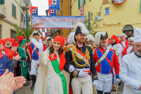 Ivrea, Italy - February 19, 2023: The millers daughter and other participants, a tradition that is part of the historical carnival of Ivrea, Piedmont, Northern Italyのeditorial素材