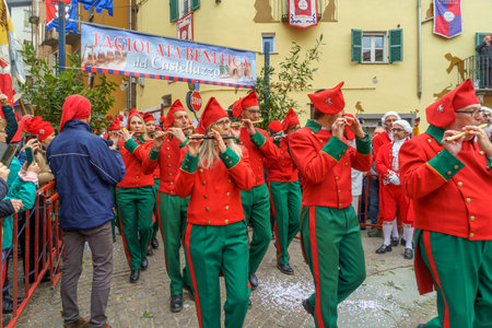 Ivrea, Italy - February 19, 2023: Band of musicians march, a tradition that is part of the historical carnival of Ivrea, Piedmont, Northern Italyのeditorial素材