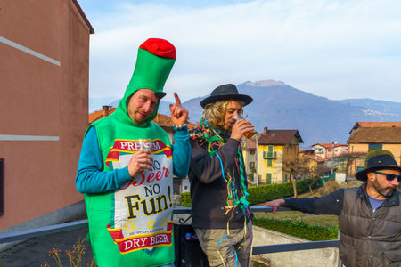 Schignano, Italy - February 18, 2023: Spectators in costume, part of the traditional carnival of Schignano, Lake Como, Lombardy, Northern Italyのeditorial素材