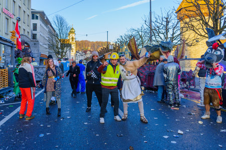 Lucerne, Switzerland - February 21, 2023: Scene of streets with participant and others, some in costumes, during the Fasnacht Carnival, in Lucerne (Luzern), Switzerlandのeditorial素材
