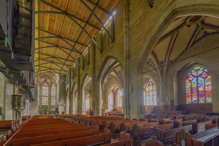 Bern, Switzerland - February 22, 2023: Interior view of the cathedral (Berner Munster), with visitors, in Bern, Switzerlandのeditorial素材