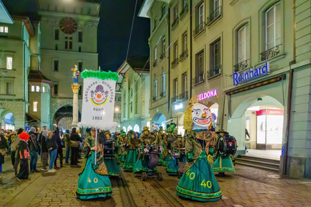 Bern, Switzerland - February 23, 2023: Guggenmusik band in costumes march in the street, part of the carnival of Bern, Switzerlandのeditorial素材