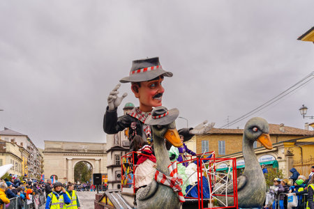 Crema, Italy - February 26, 2023: Carnival parade, with allegorical figure wagon, and crowd, in Crema, Lombardy, Northern Italyのeditorial素材