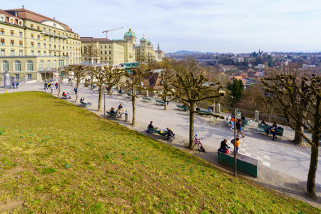 Bern, Switzerland - February 22, 2023: View of the city from the Kleine Schanze hill, with various buildings, locals, and visitors, in Bern, Switzerlandのeditorial素材
