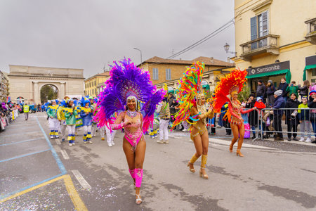 Crema, Italy - February 26, 2023: Carnival parade, with dancers in costumes, and crowd, in Crema, Lombardy, Northern Italyのeditorial素材