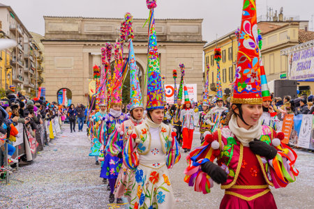 Crema, Italy - February 26, 2023: Carnival parade, with dancers in costumes, and crowd, in Crema, Lombardy, Northern Italyのeditorial素材