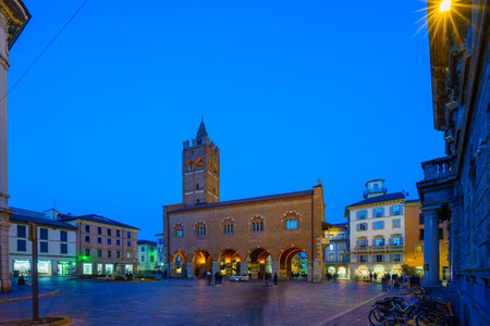Monza, Italy - February 25, 2023: Evening view of the Arengario palace, with its piazza and visitors, in Monza, Lombardy, Northern Italyのeditorial素材