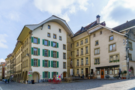 Bern, Switzerland - February 23, 2023: Scene of the Rathausplatz with the Vennerbrunnen fountain, locals, and visitors, in Bern, Switzerlandのeditorial素材