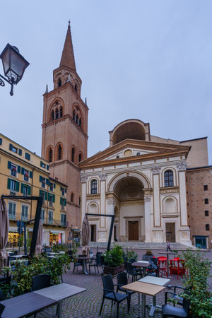 Mantua, Italy - February 27, 2023: View of the Piazza Andrea Mantegna, and the Basilica di SantAndrea, with local businesses, in Mantua (Mantova), Lombardy, Northern Italyのeditorial素材