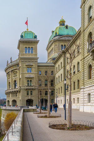 Bern, Switzerland - February 22, 2023: View of the Parliament Building (Bundeshaus), with locals, and visitors, in Bern, Switzerlandのeditorial素材