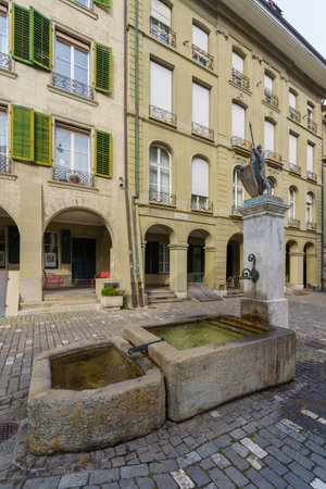 Bern, Switzerland - February 22, 2023: View of the Junkerngassbrunnen fountain and its surroundings, in Bern, Switzerlandのeditorial素材