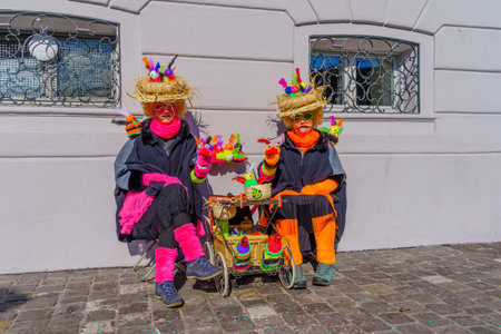 Lucerne, Switzerland - February 21, 2023: Scene of streets with participant and others, some in costumes, during the Fasnacht Carnival, in Lucerne (Luzern), Switzerlandのeditorial素材